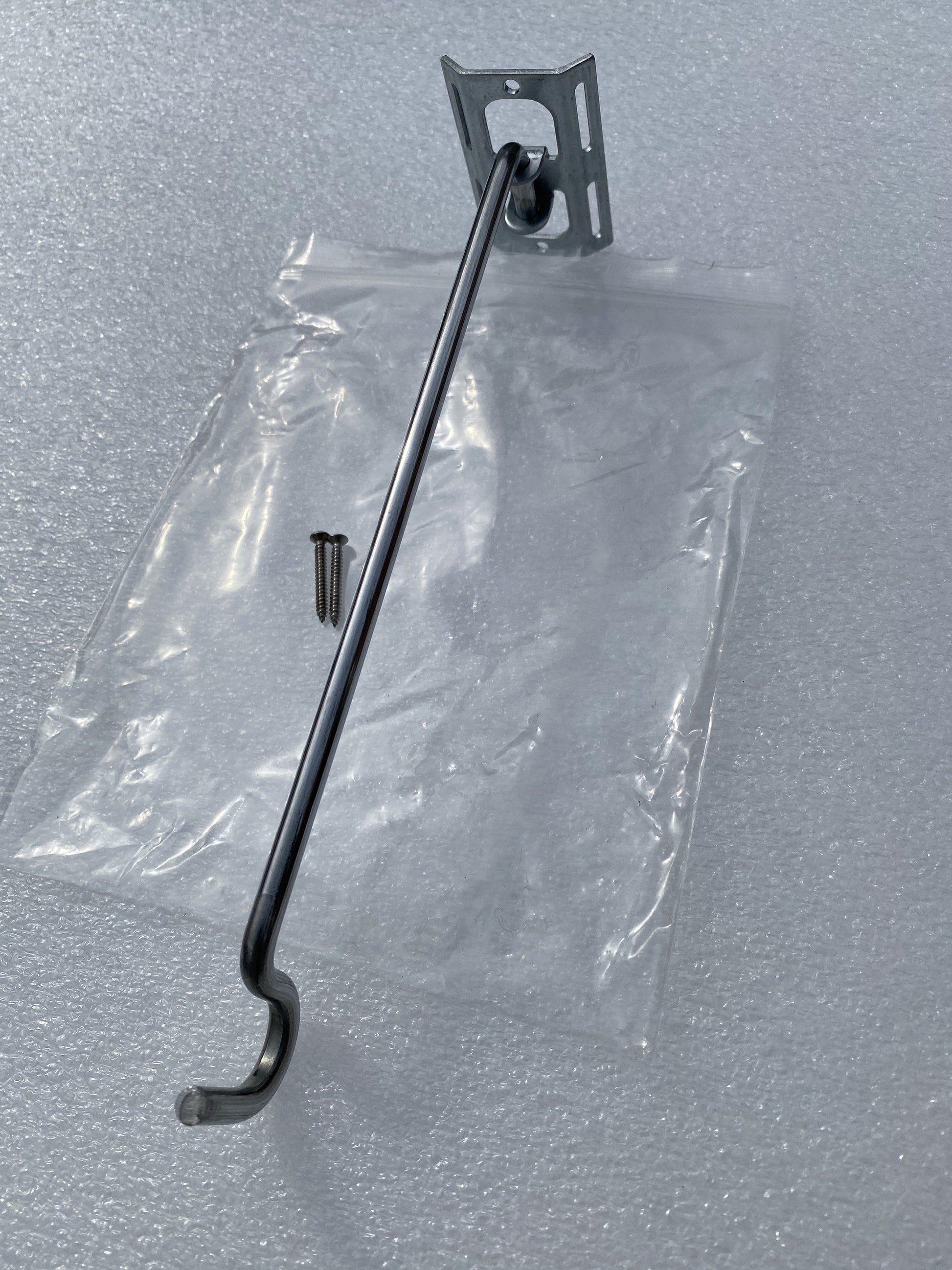 Image shows one assembled bird feeder hanger bracket. Available in a 3 pack and includes 3 bird feeder hanger bars, 3 brackets and 6 screws. Hanger bar has a deep hooked end to securely retain a bird feeder, etc. Purchased in a 3 pack for £6.99 from potmagic.co.uk. Can be quickly screw fitted to fences, pergolas and walls with screw fittings provided. Brackets are made from strong galvanised steel. Hook-ended hanger bar is made from strong 6mm diameter shiny galvanised steel and are approx 210mm long.